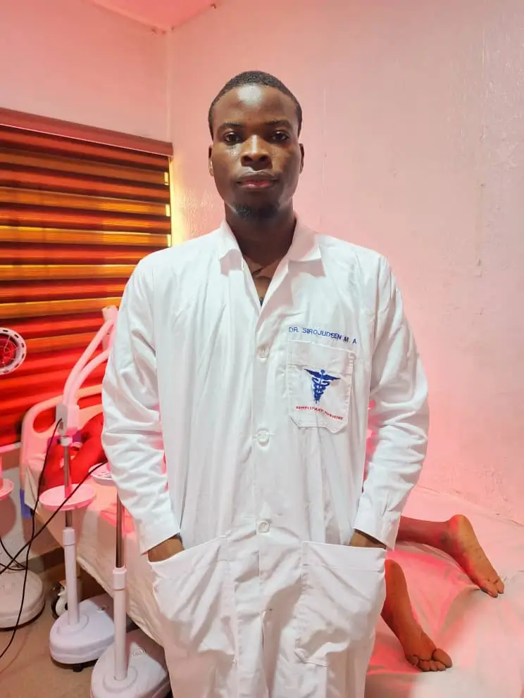Dr Mustopha with Patient